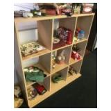 9 unit cubby shelf with assorted Christmas Items and decor