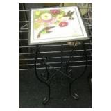 Wrought iron stand with floral decor