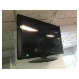 32 inch Flat Screen TV with remote and wall bracket, in working condition