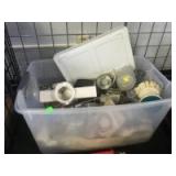 Plastic tote with assorted kitchen appliances and utensils