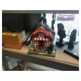 Various Carved Wood Statues, Christmas House, and more