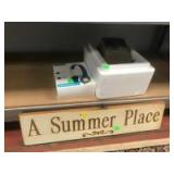 Headphones, Speaker and a Wooden "A Summer Place" sign Headphones, Speaker and a Wooden "A Summer Place" sign