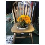 Repurposed chair into a flower pot holder