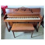 Classic piano with bench.