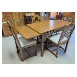 Dining room table with 4 chairs and 2 pull out