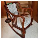 Stylish wooden rocking chair with a woven seat