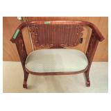 Elegant and stylish dark brown bench with carving