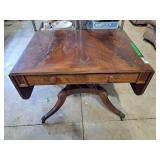 Dining table with claw feet on castor