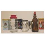 7 collectible glass jars and metal tins.