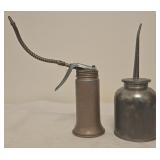 2 vintage oil cans, silver can is 8ï¿½ tall.