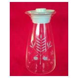 Pyrex glass carafe with a turquoise 'Apple Tree'