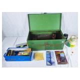 Metal tool box with assortment of tools and stain