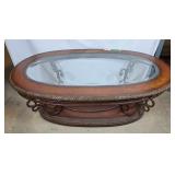 Oval glass top coffee table with steel frame,