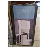 Hannah behind the toilet cabinet. Open box