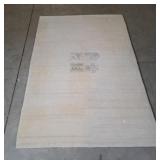Wool area rug with minimalist design 73" X 48"