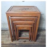 Set of 4 wooden nesting tables with intricate