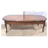 Mid-sized brown coffee table unique scalloped