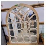 Large arched window pane mirror designed with a