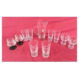 Fancy waterpitcher  and assortment of glasses