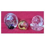 Trio of glass paperweights
