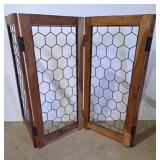 Wooden panel screen with a honeycomb metal mesh