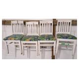 4 white wooden dining chairs with patterned