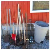 Garbage can with assorted garden tools!
