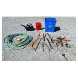 Garden hose, watering can, gas can, hack saw,