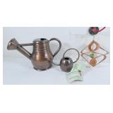2 copper decorative watering cans and 1 copper