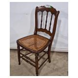 Spindle back with cane seat accent chair