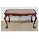 Elegant Gibbard coffee table with claw feet. 36"