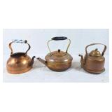 Trio of copper tea pots
