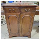 Petite cabinet with 2 drawers and 2 doors.