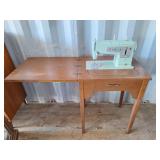 Singer sewing machine with cabinet. (No cord or