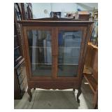 Vintage antique-style  china cabinet has distinct