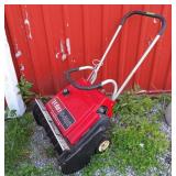 Toro S-200 snow blower.  20' wide gas motor