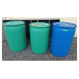 Trio of 50 gal plastic rain barrels 23" l x 35" h