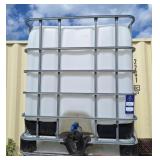 1000 liter tank with metal cage. 37 1/2" l 46" w