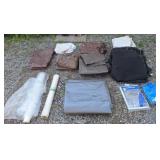 Assorted tarps, mesh, and plastic