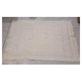 Ivory or cream-colored woven area rug - 61"lï¿½45"w