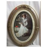 Oval Framed Print of Lady in Dress holding Flowers
