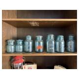 2 SHELVES OF MASON JARS W LIDS