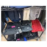 LOT OF ADIDAS ITEMS CONTENTS ON SHELF LOT OF ADIDAS ITEMS CONTENTS ON SHELF