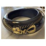LUCITE BANGLE BRACELET W ZIPPER INTERIOR LUCITE BANGLE BRACELET W ZIPPER INTERIOR