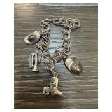 CHARM BRACELET (FIREMANS HAT IS STERLING SILVER)