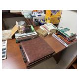 ALL OF THE OFFICE SUPPLIES ON THE DESK