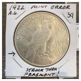 1922 PEACE SILVER DOLLAR STRUCK THRU ERROR