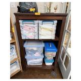 SHELF UNIT W CONTENTS INSIDE LOT OF FABRIC