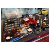 ALL OF THE TOOLS SITTING ON AND IN THE TOOLBOX