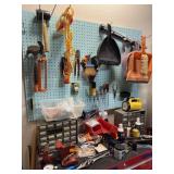 ALL OF THE TOOLS HANGING ON THE PEG BOARD